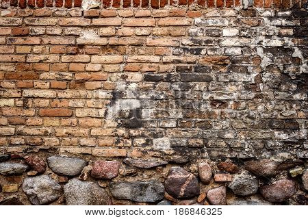 Yellow brick wall background with stone basement