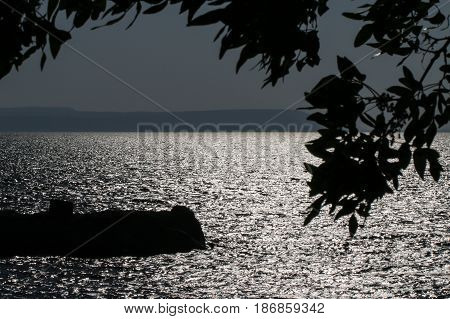 Night view of salt Bafa Lake shore and historical castle ruins. Mugla - Turkey. Sunset.