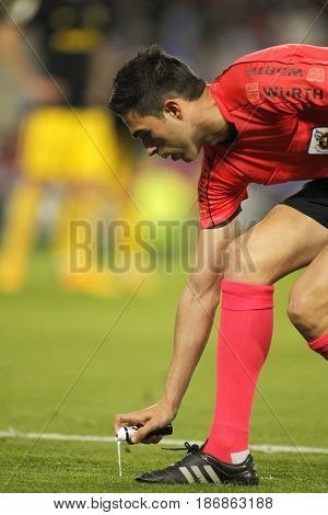 BARCELONA, SPAIN - MAY, 6: Referee Inaki Vicandi Garrido marks kick off positions with a Vanishing spray during a Spanish League match at the RCDE Stadium on May 6 2017 in Barcelona Spain