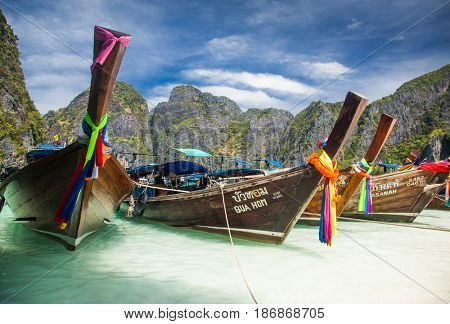 KO PHI PHI LEH, THAILAND, February 1, 2014: Traditional long tail boats on the beach of Maya Bay, Andaman Sea, famous tourist destination in the Ko Phi Phi achipelago