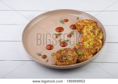 Russian draniki food served on a wooden table