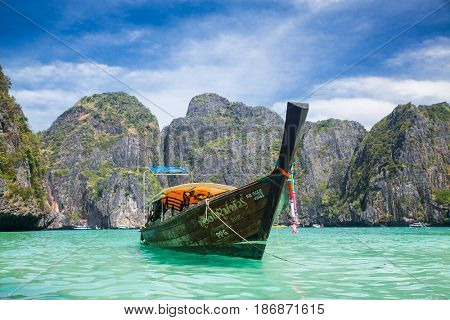 KO PHI PHI LEH, THAILAND, February 1, 2014: Traditional long tail boats on the beach of Maya Bay, Andaman Sea, famous tourist destination in the Ko Phi Phi achipelago