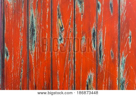 Vintage red painted old wood planks with cracks and scratches for natural design, patterns, decoration