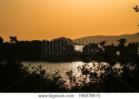 Salt Bafa Lake shore and historical castle ruins. Mugla - Turkey. Sunset.