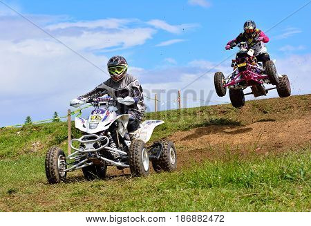 Unidentified Racers Rides A Quad Motorbike.
