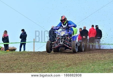 Unidentified Racer Rides A Quad Motorbike.