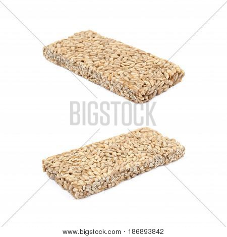 Single piece of a gozinaki confection sweets isolated over the white background, set of two different foreshortenings