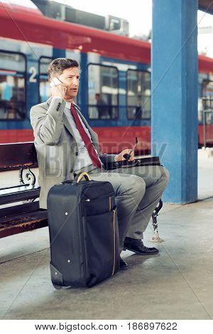 Portrait of a businessman in a train station.