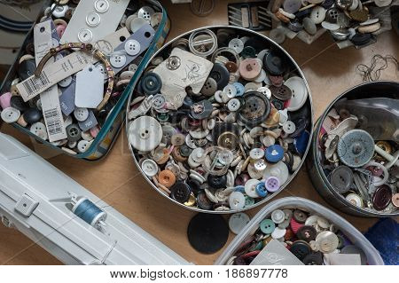 Buttons in tin cans found in an antique store