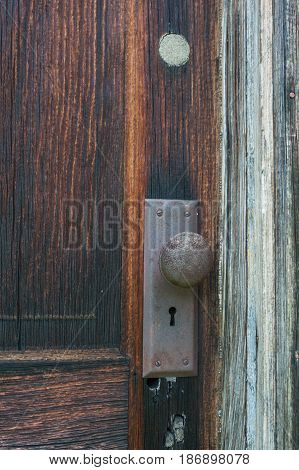 Old wooden door with rusty door knob