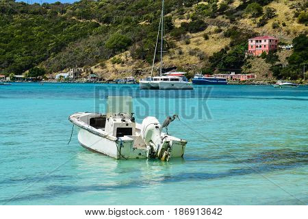 Small boat in quiet cove on Tortola, BVI
