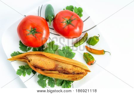 Mexican Tamales Made Of Corn And Chicken Isolated On White