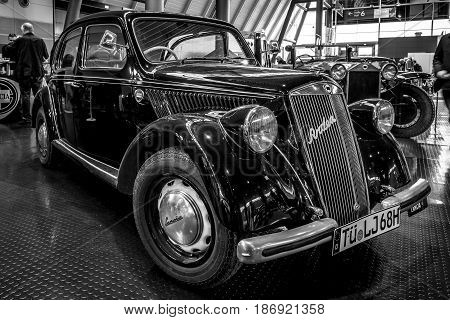 STUTTGART GERMANY - MARCH 03 2017: Small family car Lancia Ardea Berlina 1949. Black and white. Europe's greatest classic car exhibition 