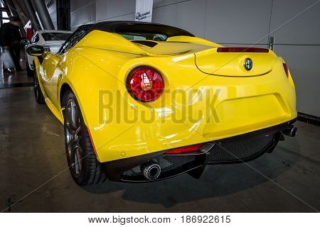 STUTTGART GERMANY - MARCH 03 2017: Sports car Alfa Romeo 4C Spider (Type 960) 2015. Rear view. Europe's greatest classic car exhibition 