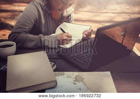 Woman working in a natural garden on vacation.