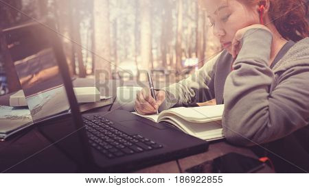 Woman working in a natural garden on vacation.
