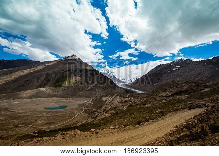Beautiful nature on Dran Drung Glacier clouds covering the mountain peaks Zanskar, Himalayas India.