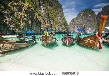 KO PHI PHI LEH, THAILAND, February 1, 2014: Traditional long tail boats on the beach of Maya Bay, Andaman Sea, famous tourist destination in the Ko Phi Phi achipelago