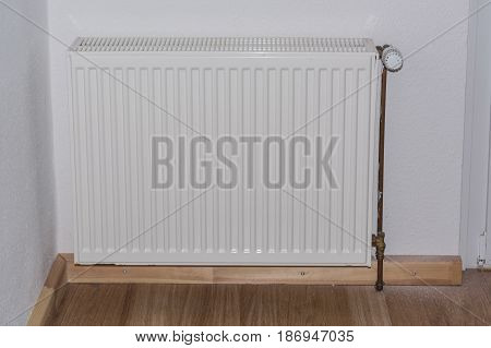 Old panel radiators in a renovated room.