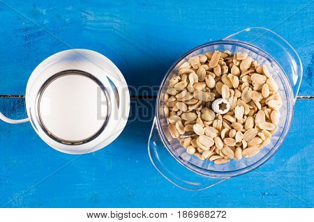 Blanched Peanuts In The Blender In Flat Lay Above Blue Wooden Ba