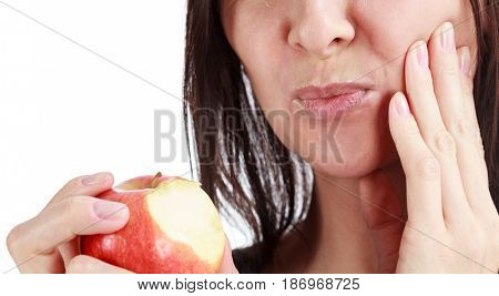 Closeup of woman in strong toothache pain with hands over face. Dental health and care concept. Isolated on white background.
