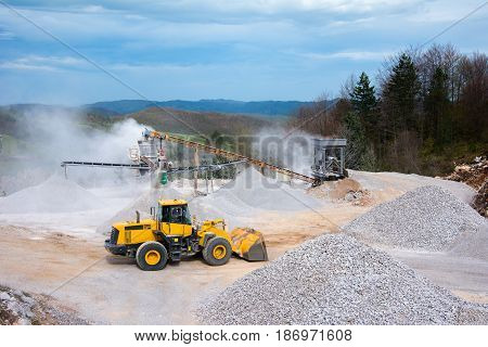 Quarry aggregate with heavy duty machinery picture