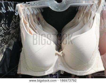 view of clothes shop with bra hanged on stand