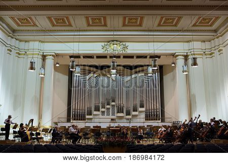 CRACOW POLAND - SEPTEMBER 25 2015: View of the stage of the concert hall at the Cracow Philharmonic with the new Orgelbau organ in the background. Cracow Poland