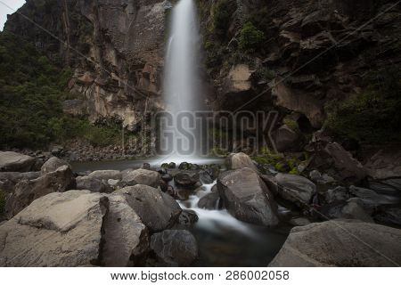 Flow Of A Waterfall On The Rocks In  Waipu New Zealand