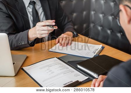 Job Interview Concept , Senior Manager Reading A Resume During A Job Interview Employee Young Man Me