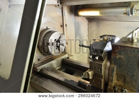 Spindle Chuck And Installed Metal Part On High Precision Cnc Industrial Lathe Turning Machine. Close