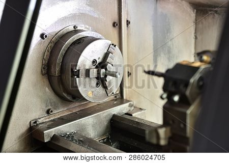 Spindle Chuck And Installed Metal Part On High Precision Cnc Industrial Lathe Turning Machine. Close