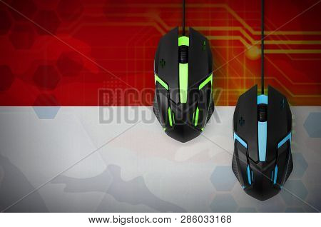 Indonesia Flag  And Two Mice With Backlight. Online Cooperative Games. Cyber Sport Team