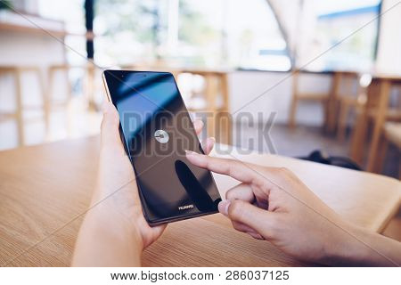 Chiang Mai, Thailand - Jan. 19,2019: Woman Holding Huawei With Uber Apps. Uber Is Smartphone App Tra