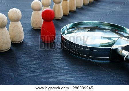 Identify Concept. Recruitment And Talent Management. Red Figurine And Magnifier.