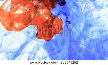 Red And Blue Ink That Enters The Water Forming Animated Textures, Footage Ideal For Motiongraphic An