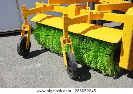 Road Sweeper. Yellow Street Sweeper Machine Fow Washing And Cleaning Asphalt Road.