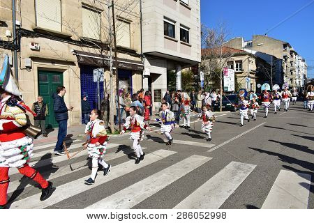 Verin, Spain, 24 Feb 2019. Famous Carnival And Street Parade With Cigarrons Costumes. Ourense Provin