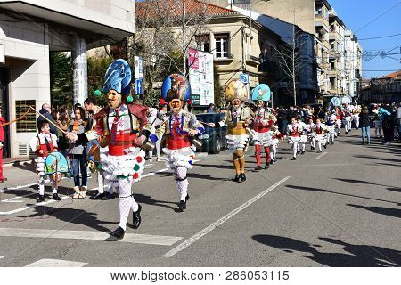 Verin, Spain, 24 Feb 2019. Famous Carnival And Street Parade With Cigarrons Costumes. Ourense Provin
