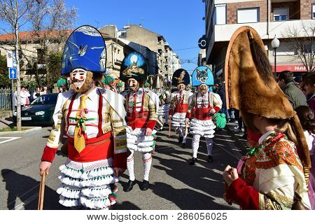 Verin, Spain, 24 Feb 2019. Famous Carnival And Street Parade With Cigarrons Costumes. Ourense Provin