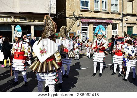Verin, Spain, 24 Feb 2019. Famous Carnival And Street Parade With Cigarrons Costumes. Ourense Provin