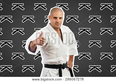Сontemporary Portrait A Young Man In White Kimono For , Judo, Jujitsu Posing  On A White-black Backg