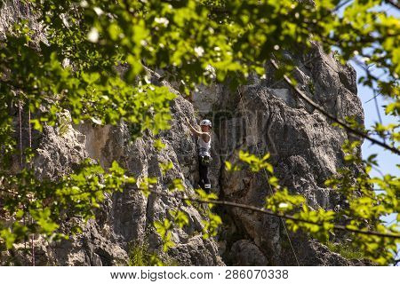 Doberdo, Italy - April, 22: View Of A Passionate Female Climber On Doberdo Crag On April 22, 2018