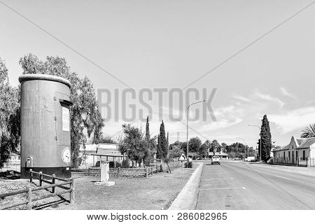 Calvinia, South Africa, August 30, 2018: A Street Scene In Calvinia. The 6m High Flower Postbox, Ori