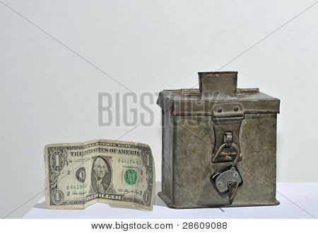 old steel money box with padlock and dollar