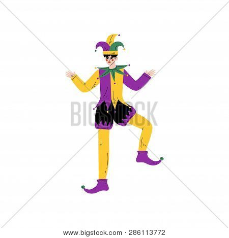 Young Man Wearing Bright Traditional Mardi Gras Costume And Jester Headgear Celebrating Carnival Par