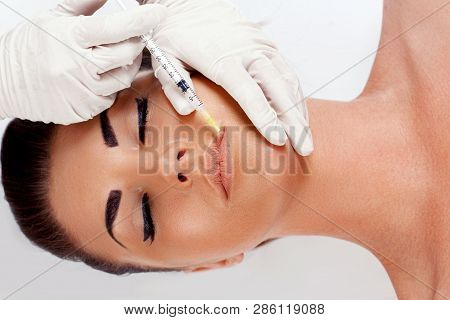 Woman Getting Beauty Injection For Lips.  Beauty. Plastic Surgery, Beauty, Spa Concept. Facial Rejuv