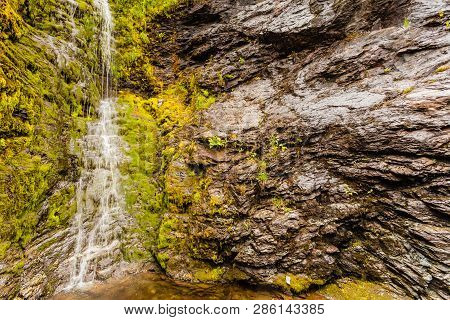 Little Waterfall In Green Summer Mountains, Norway.