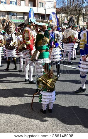 Verin, Spain, 24 Feb 2019. Famous Carnival And Street Parade With Cigarrons Costumes. Ourense Provin