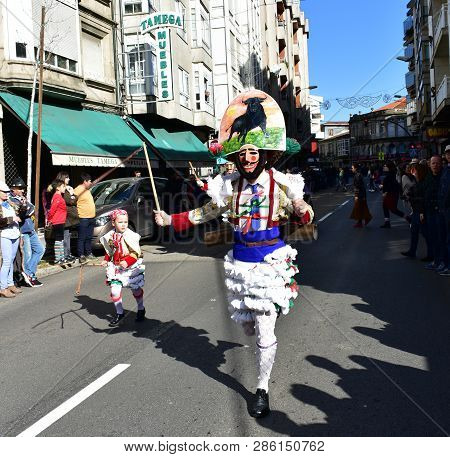 Verin, Spain, 24 Feb 2019. Famous Carnival And Street Parade With Cigarrons Costumes. Ourense Provin